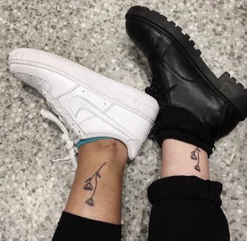 Matching flowers ankle tattoo