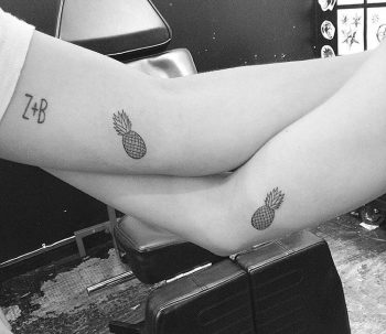 Matching pineapple tattoos