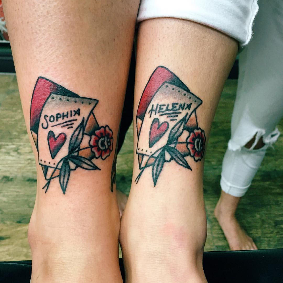 Matching traditional tattoos on ankles