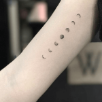 Minimal black moon phases tattoo
