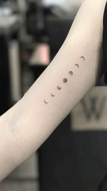 Minimal black moon phases tattoo