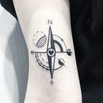 Minimal style compass tattoo