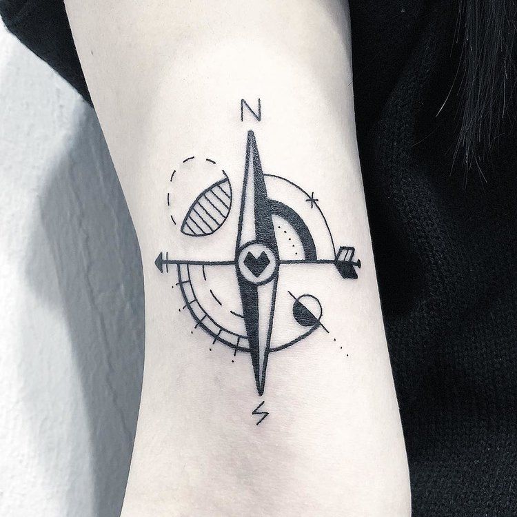 Minimal style compass tattoo