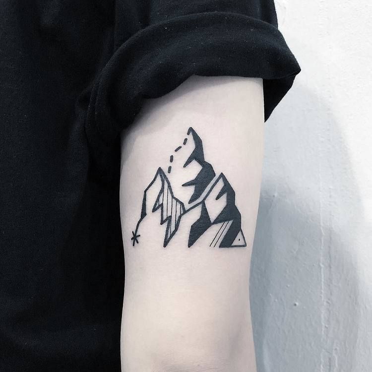 Minimalist mountain tattoo