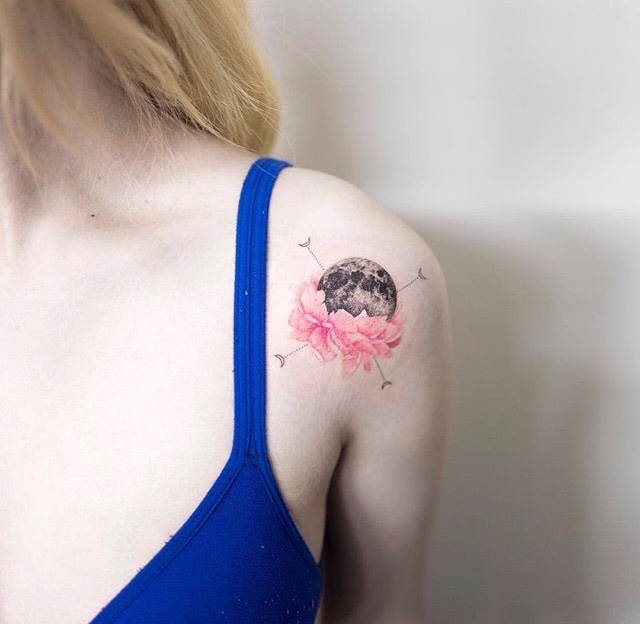 Moon in a lotus flower tattoo