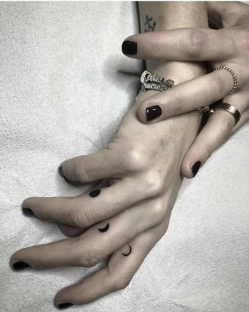 Moon phases tattoos on fingers