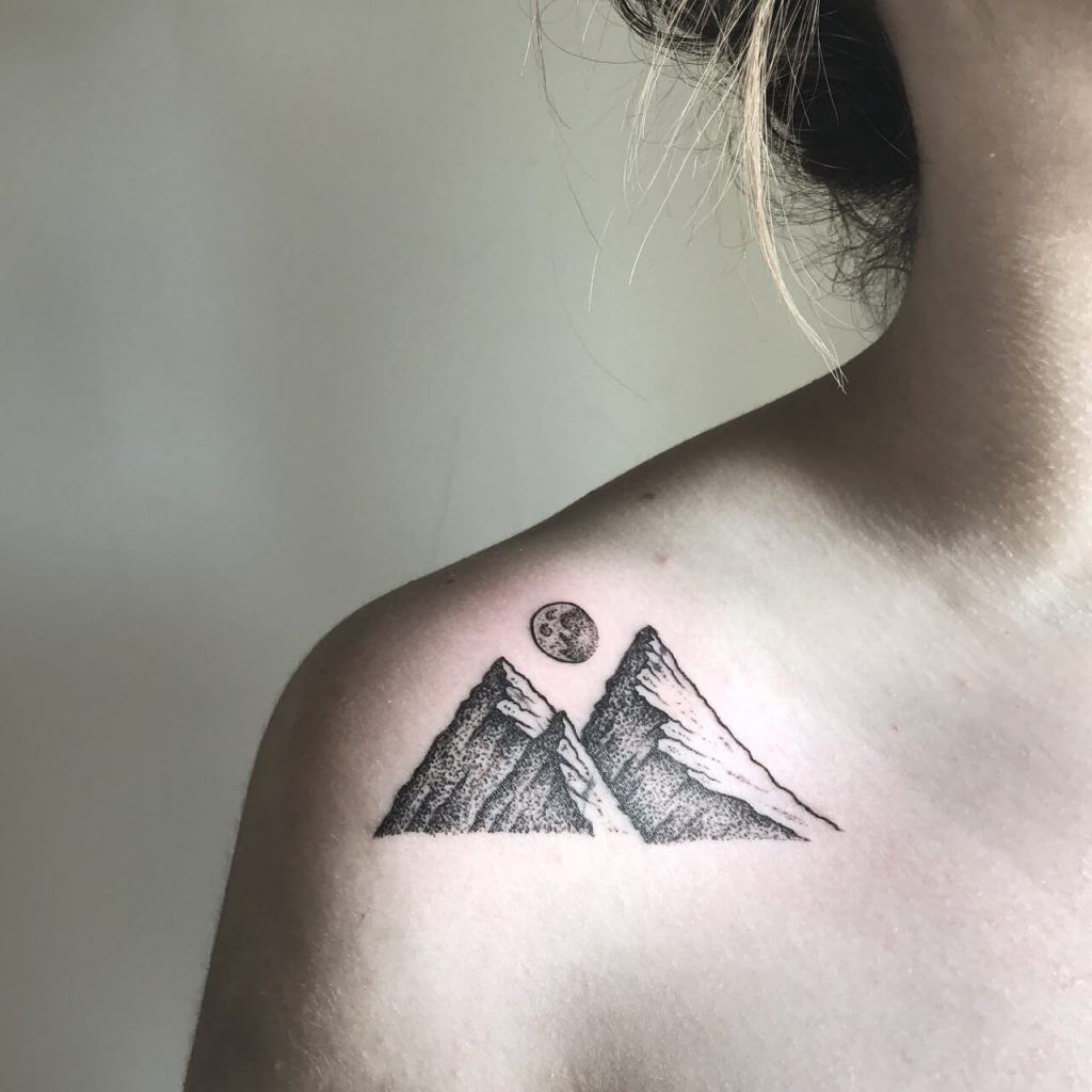 Mountains tattoo on the right shoulder