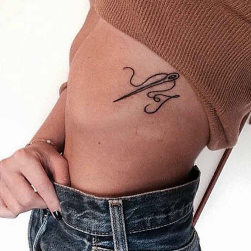 Needle and thread tattoo