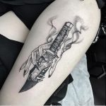 Neo traditional hand and knife tattoo
