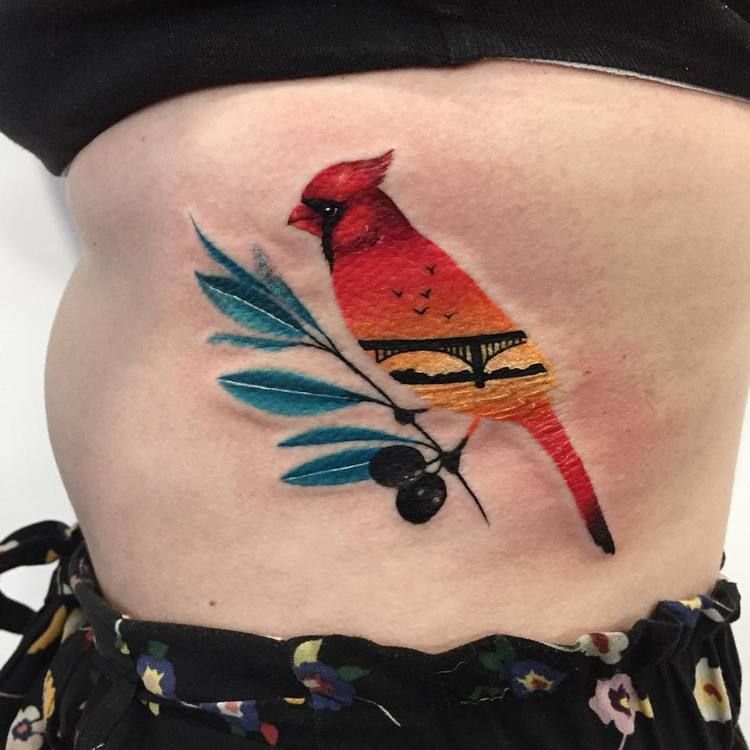 Northern cardinal tattoo on a tiny twig