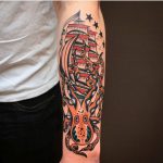 Octopus and sailing vessel tattoo