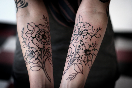 Outline black floral tattoos on both arms