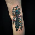 Peafowl tattoo on the arm