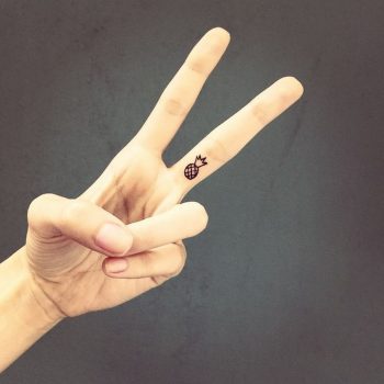 Pineapple tattoo on the finger