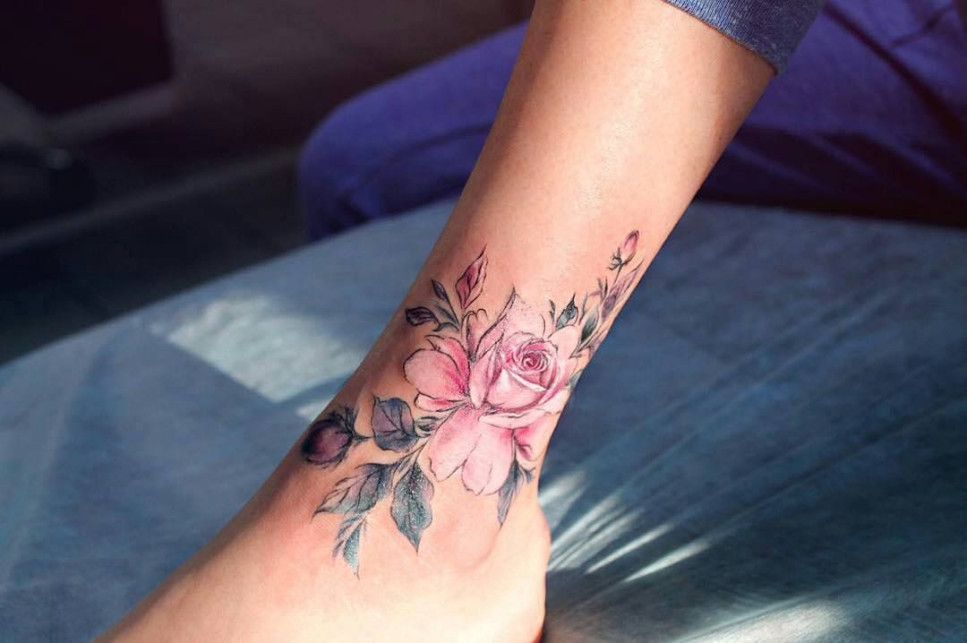 Pink rose tattoo on the ankle
