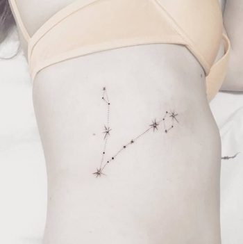 Pisces constellation tattoo on the right rib cage