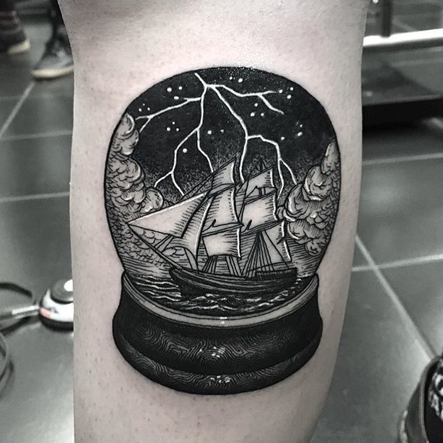 Ship in a crystal ball tattoo