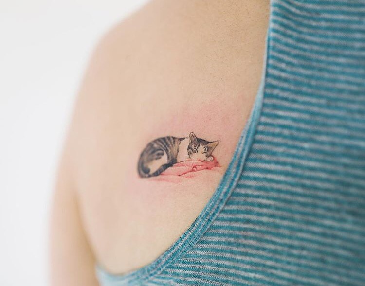 Sleeping cat tattoo