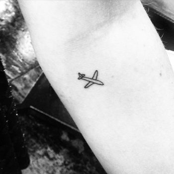 Small airplane tattoo
