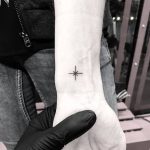 Small black star tattoo