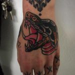 Snake tattoo on the left hand
