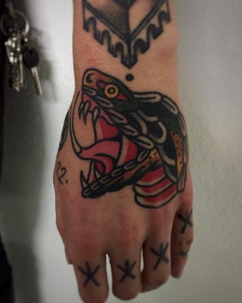 Snake tattoo on the left hand