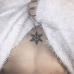 Snowflake sternum tattoo