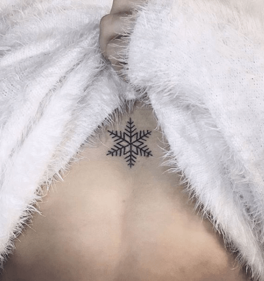Snowflake sternum tattoo