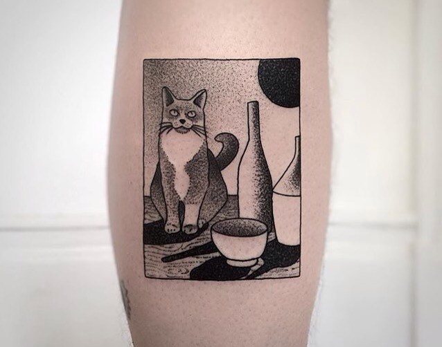 Still life tattoo with a cat