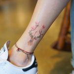 Stylized deer tattoo on the ankle