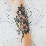 Subtle flowers tattoo design