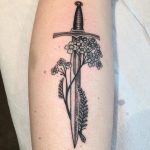 Sword and flowers tattoo