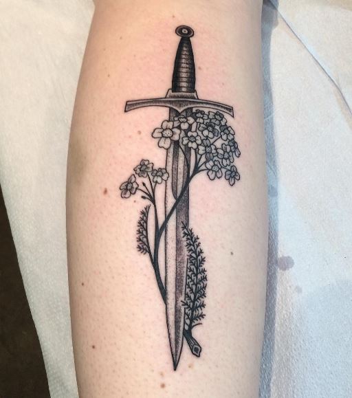Sword and flowers tattoo