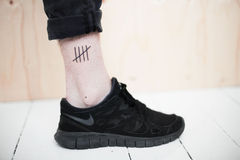 Tally mark tattoo 