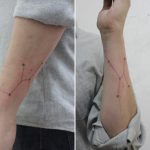 Taurus constellation tattoo on the left forearm