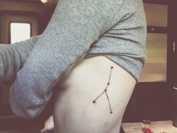 Taurus constellation tattoo on the left rib cage