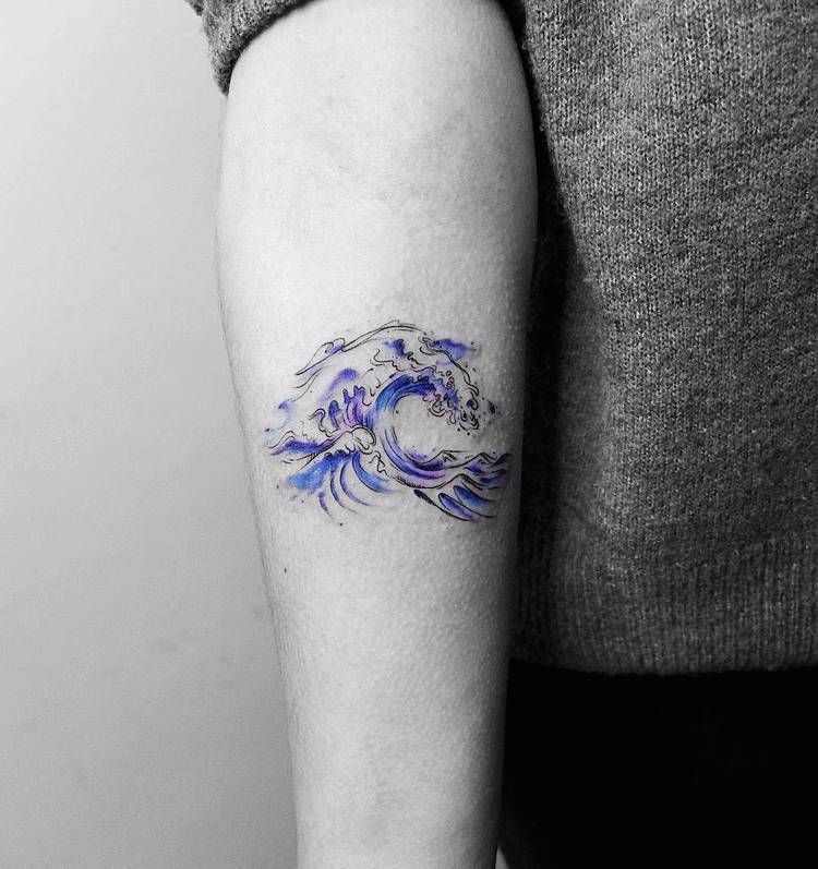 The great wave of hokusai tattoo on the arm