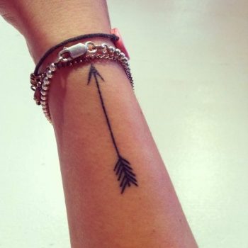 Thin small black arrow tattoo