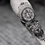 Tigger head and sacred geometry tattoo