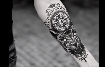 Tigger head and sacred geometry tattoo