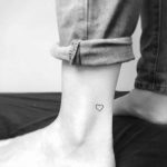 Tiny heart tattoo on the left ankle