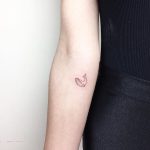Tiny outline whale tattoo