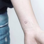 Tiny triangle tattoo on the wrist