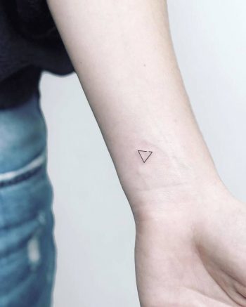 Tiny triangle tattoo on the wrist