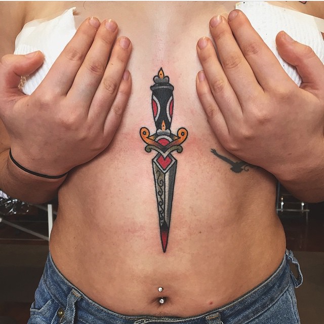 Traditional dagger tattoo on the sternum