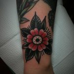 Traditional flower tattoo on the wrist