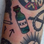 Traditional liquor bottle tattoo