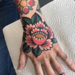 Traditional peony tattoo on the left hand