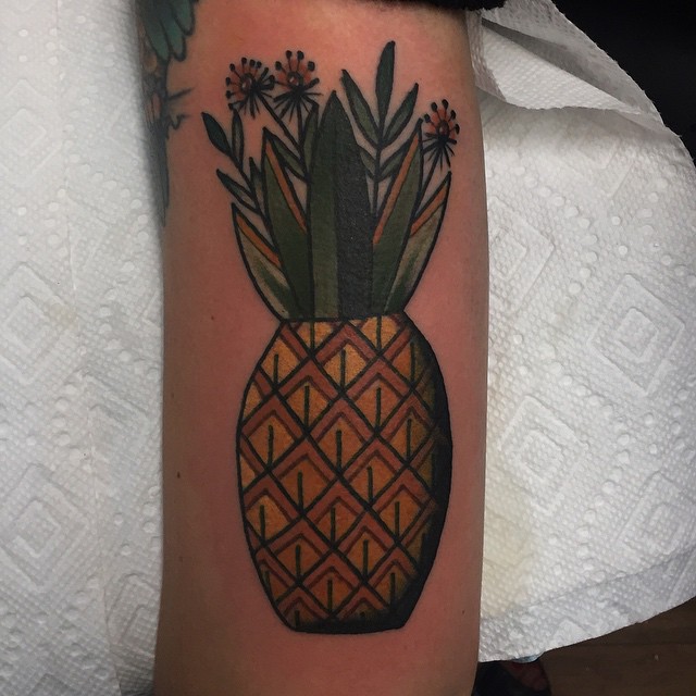 Traditional pineapple tattoo on the arm
