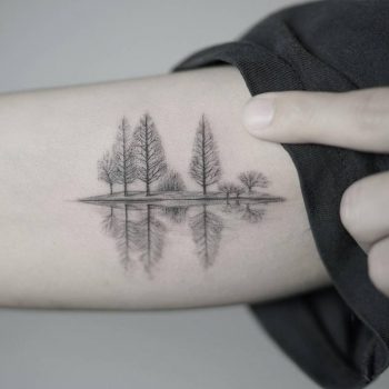 Trees reflection in the water tattoo